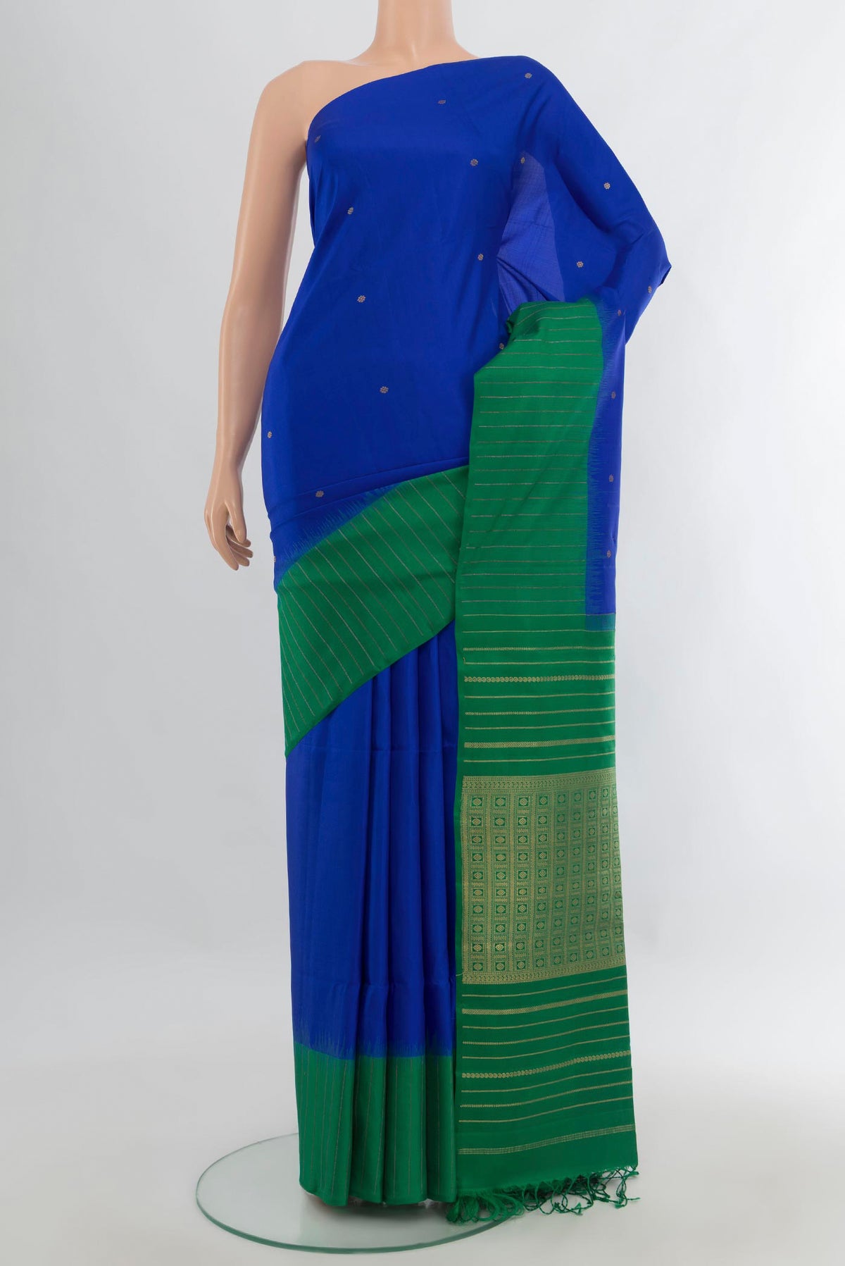 Pure Silk Royal Blue Soft Saree with Zari Butta on the body and One Side Border.  displayed on a mannequin
