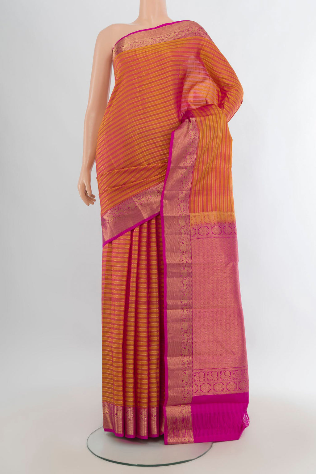 Pure Silk Mustard Kanjivaram Saree with Stripes on the body and Zari Border.  displayed on a mannequin