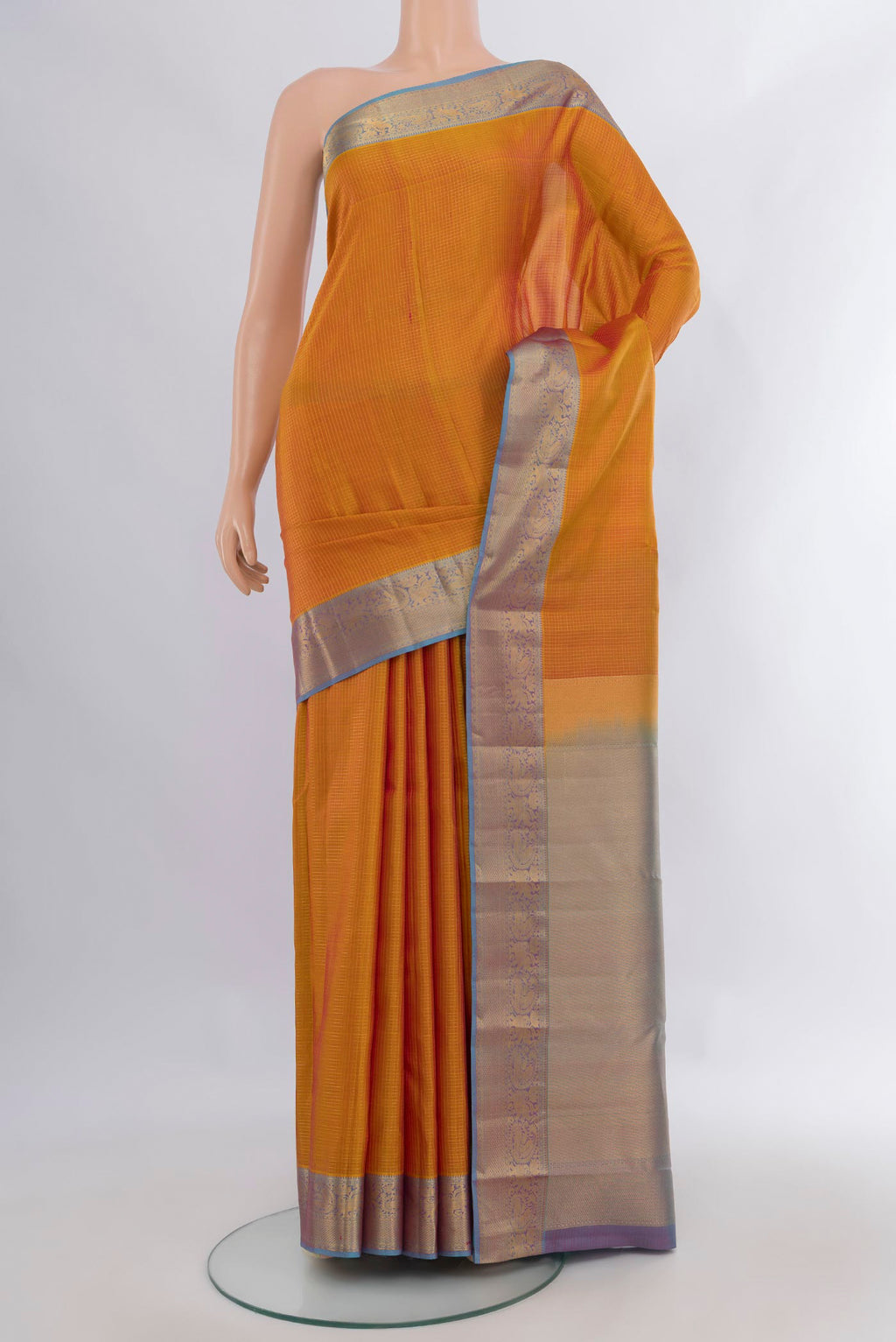 Pure Silk Mustard Kanchipuram Saree with Checked design on the body and Zari Border.  displayed on a mannequin
