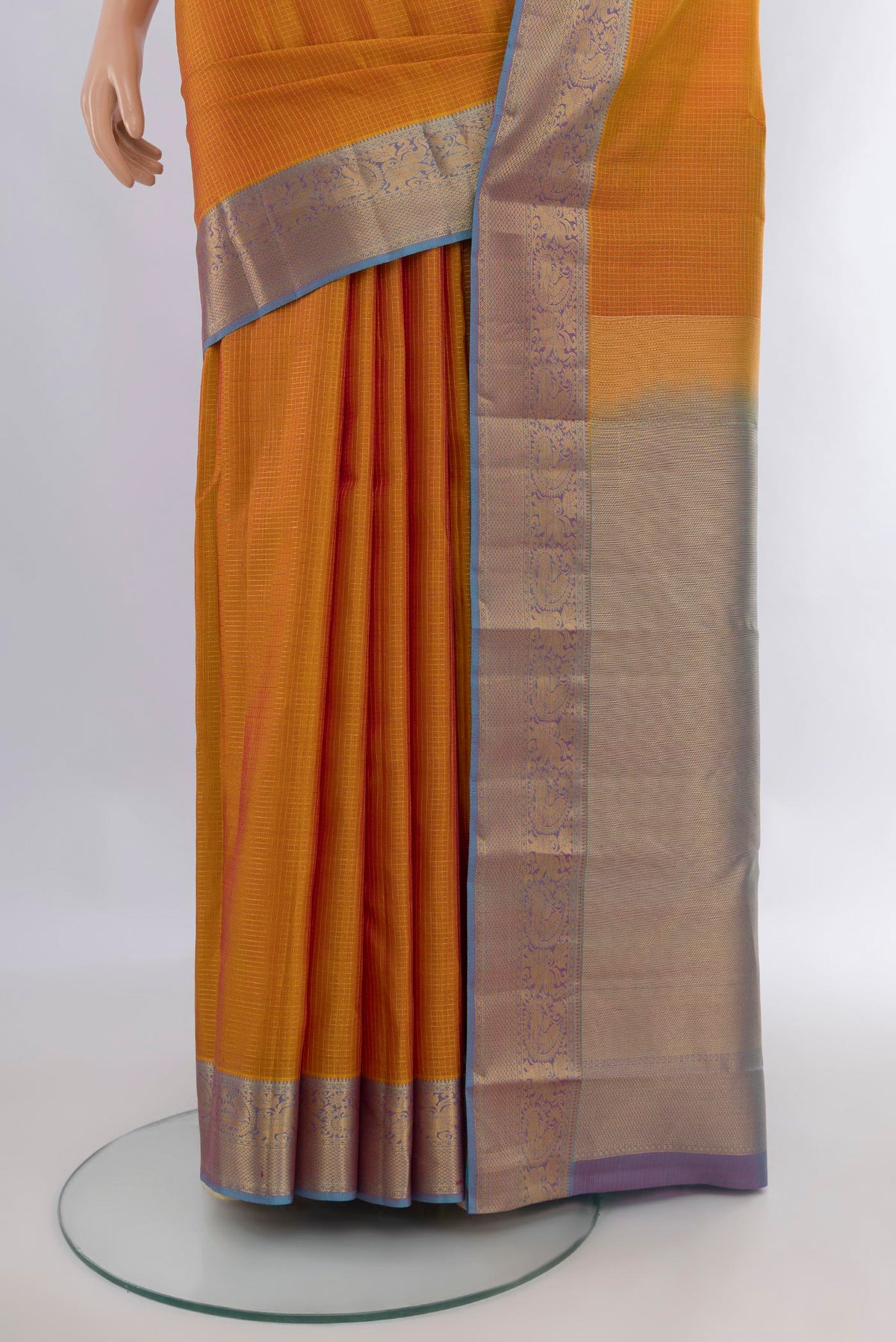 Pleats and pallu of Pure Silk Mustard Kanchipuram Saree with Checked design on the body and Zari Border. 