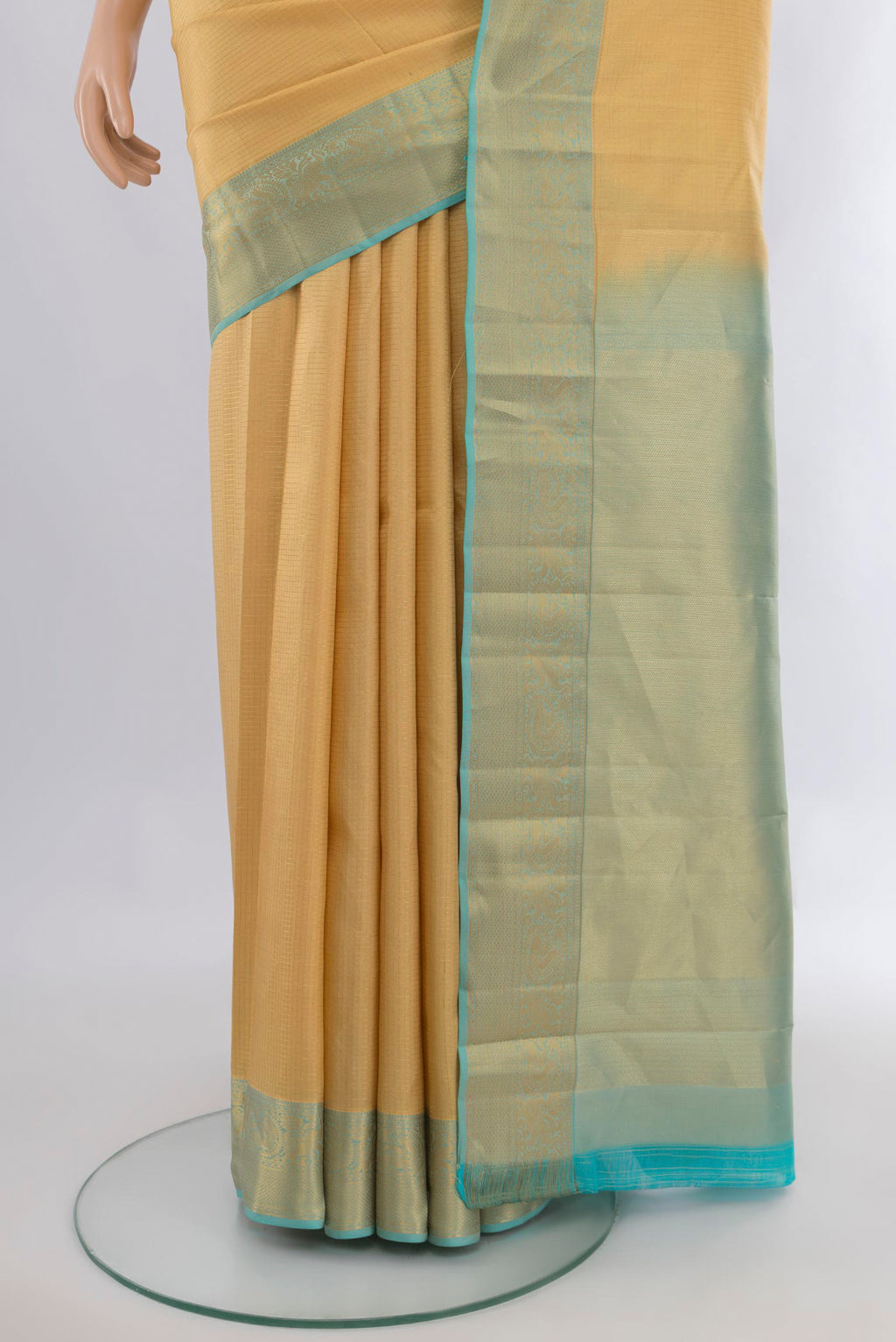 Pleats and pallu of Pure Silk Sandal Kanchipuram Saree with Checked design on the body and Zari Border. 