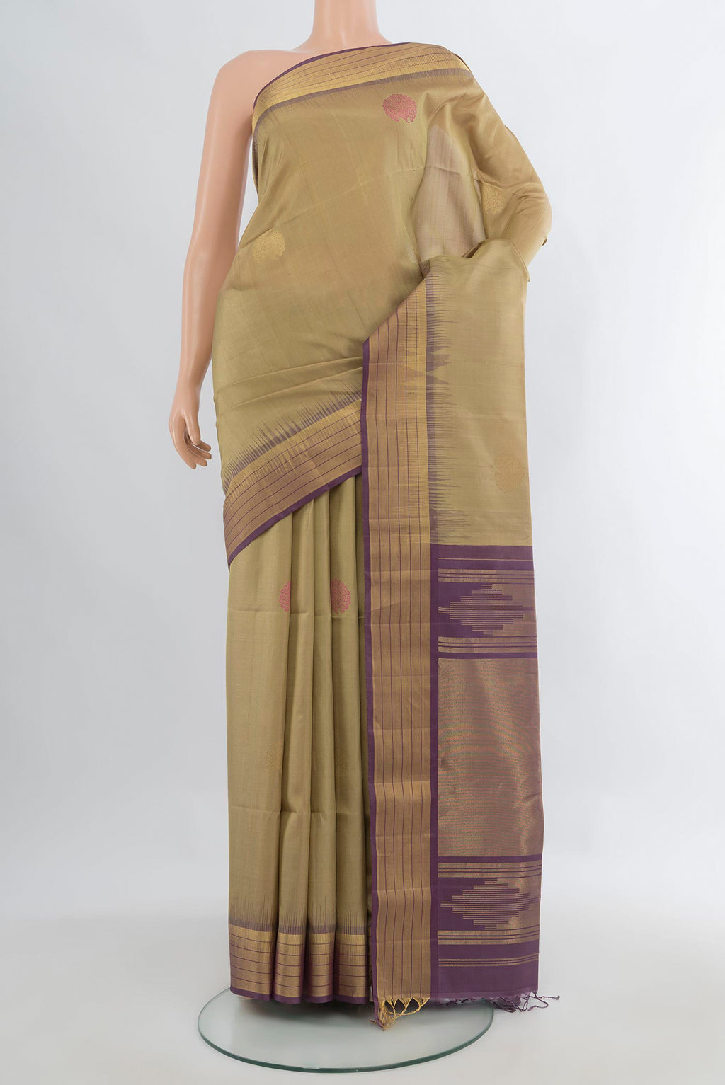 Pure Silk Beige Soft Saree with Zari Butta on the body and Zari Border.  displayed on a mannequin