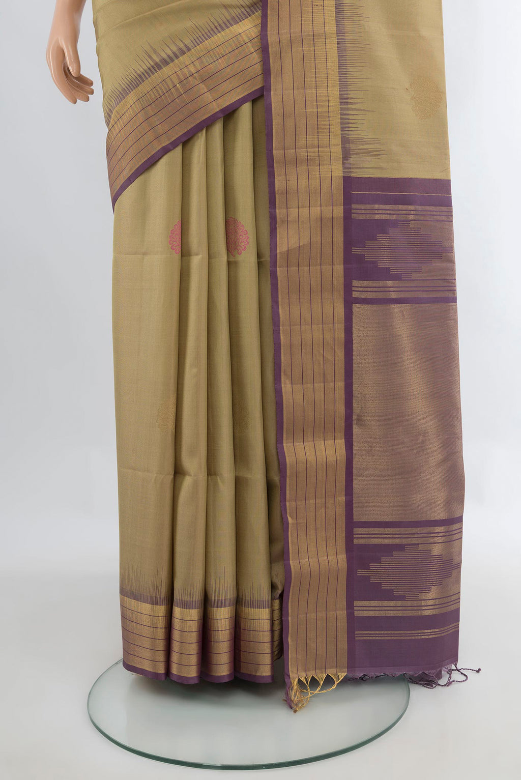 Pleats and pallu of Pure Silk Beige Soft Saree with Zari Butta on the body and Zari Border. 