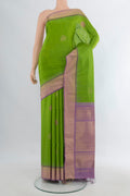 Pure Silk Parrot Green Soft Saree with Zari Butta on the body and Zari Border.  displayed on a mannequin