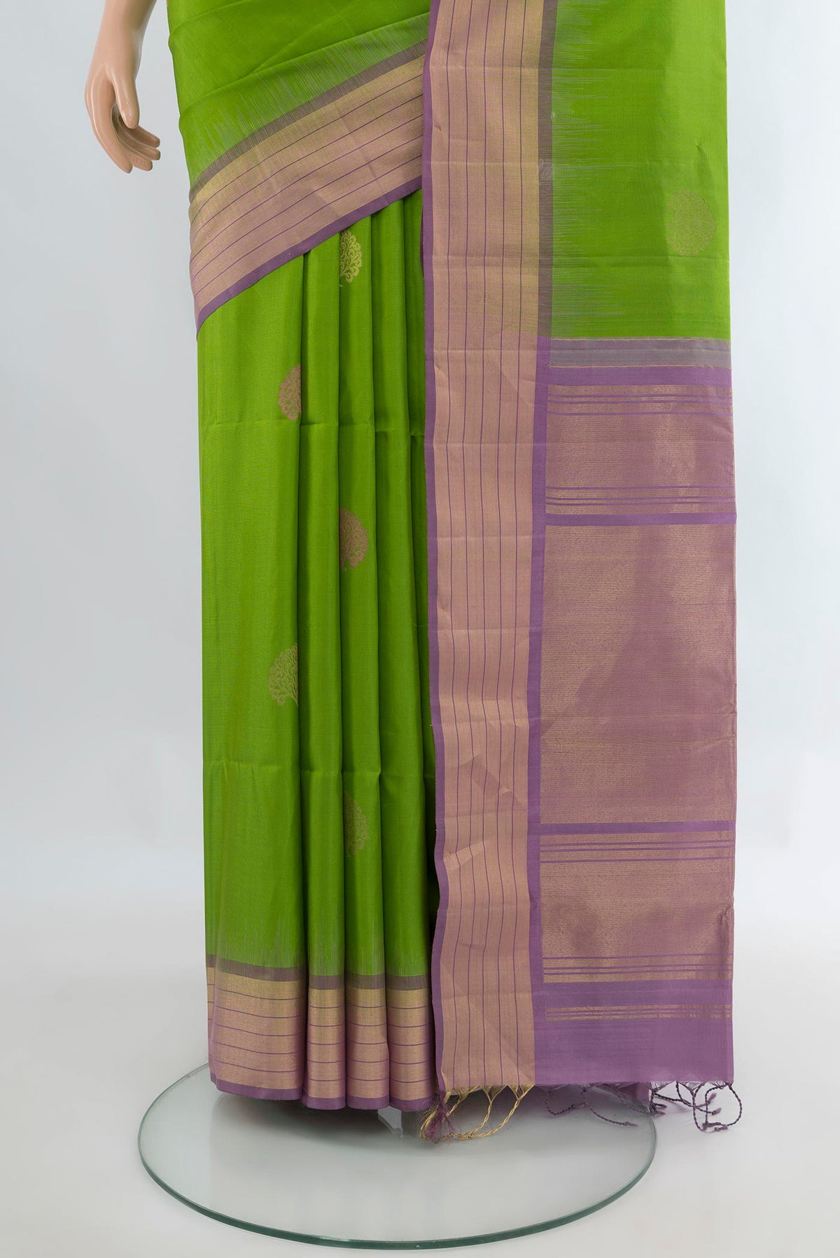 Pleats and pallu of Pure Silk Parrot Green Soft Saree with Zari Butta on the body and Zari Border. 