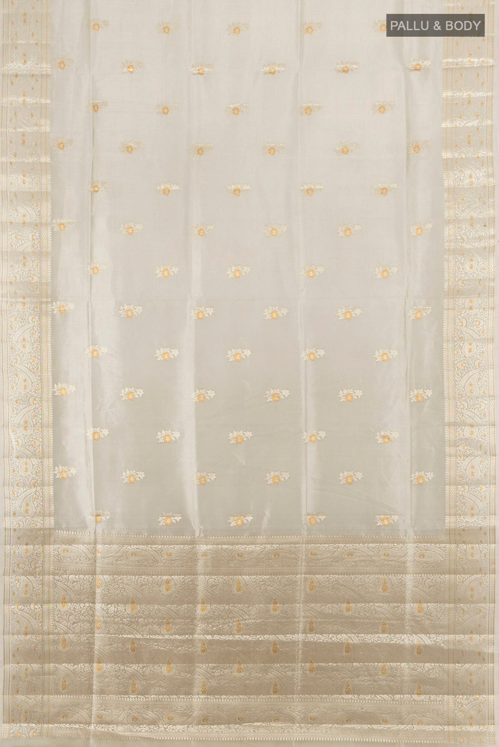 Flat view of Pure Silk Beige Banarasi Raw Saree with Zari Butta on the body and Zari Border. 