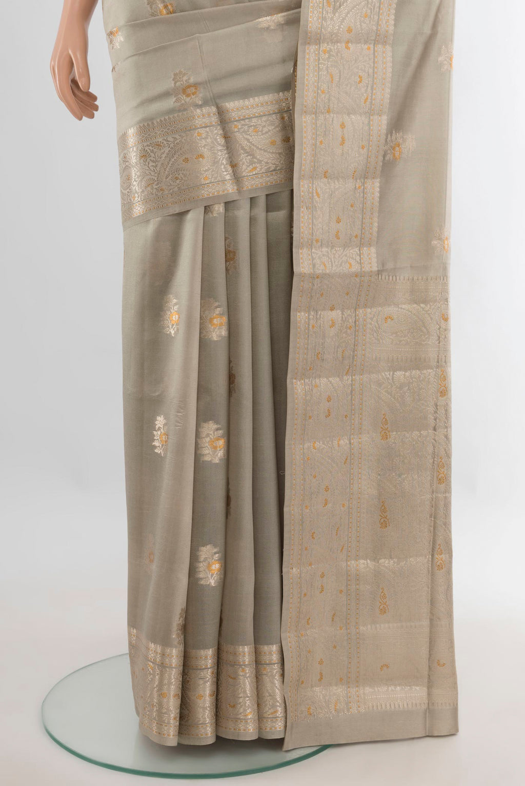 Pleats and pallu of Pure Silk Beige Banarasi Raw Saree with Zari Butta on the body and Zari Border. 