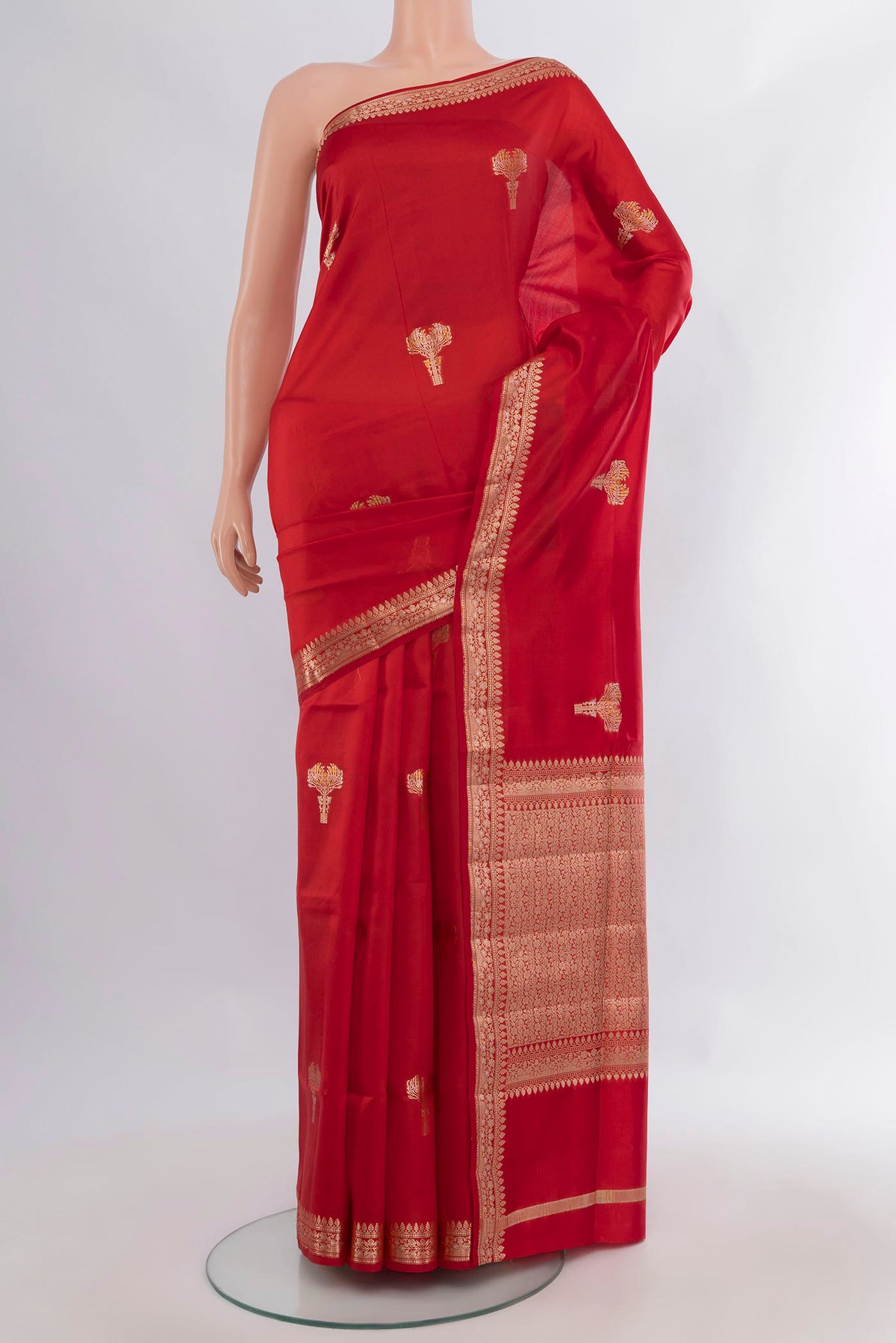 Pure Silk Red Banarasi Raw Saree with Zari Butta on the body and Zari Border.  displayed on a mannequin