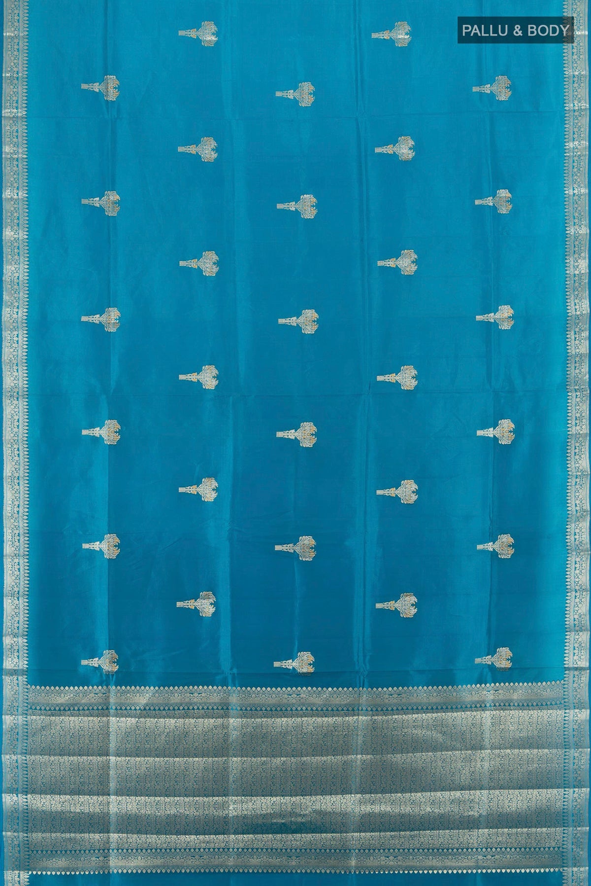 Flat view of Pure Silk Light Blue Banarasi Raw Saree with Zari Butta on the body and Zari Border. 