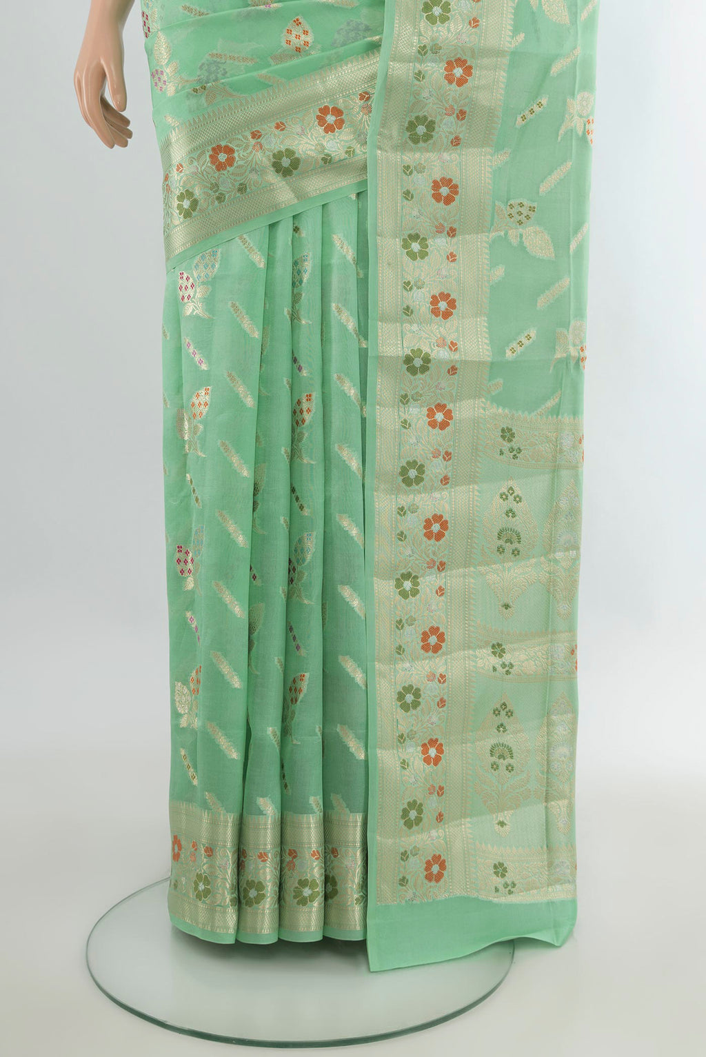Pleats and pallu of Pure Silk Light Green Banarasi Raw Saree with Zari Butta on the body and Zari Border. 