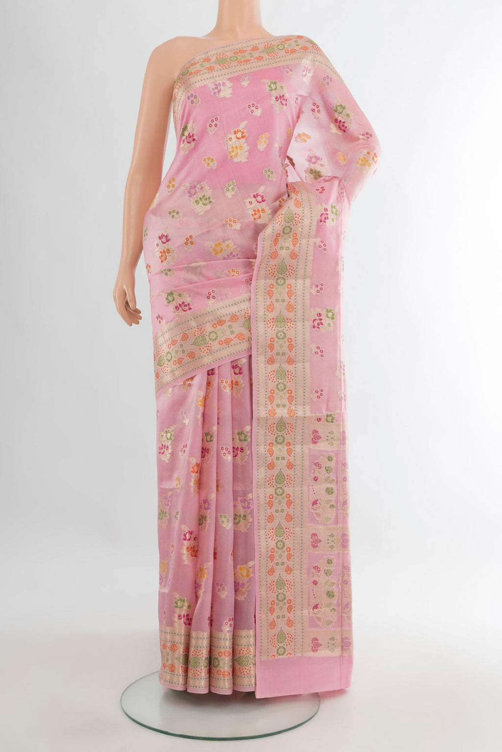 Pure Silk Rose pink Banarasi Raw Saree with Zari Butta on the body and Zari Border.  displayed on a mannequin