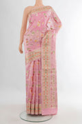 Pure Silk Rose pink Banarasi Raw Saree with Zari Butta on the body and Zari Border.  displayed on a mannequin