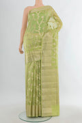 Pure Silk Pista Green Banarasi Raw Saree with Zari Butta on the body and Zari Border.  displayed on a mannequin