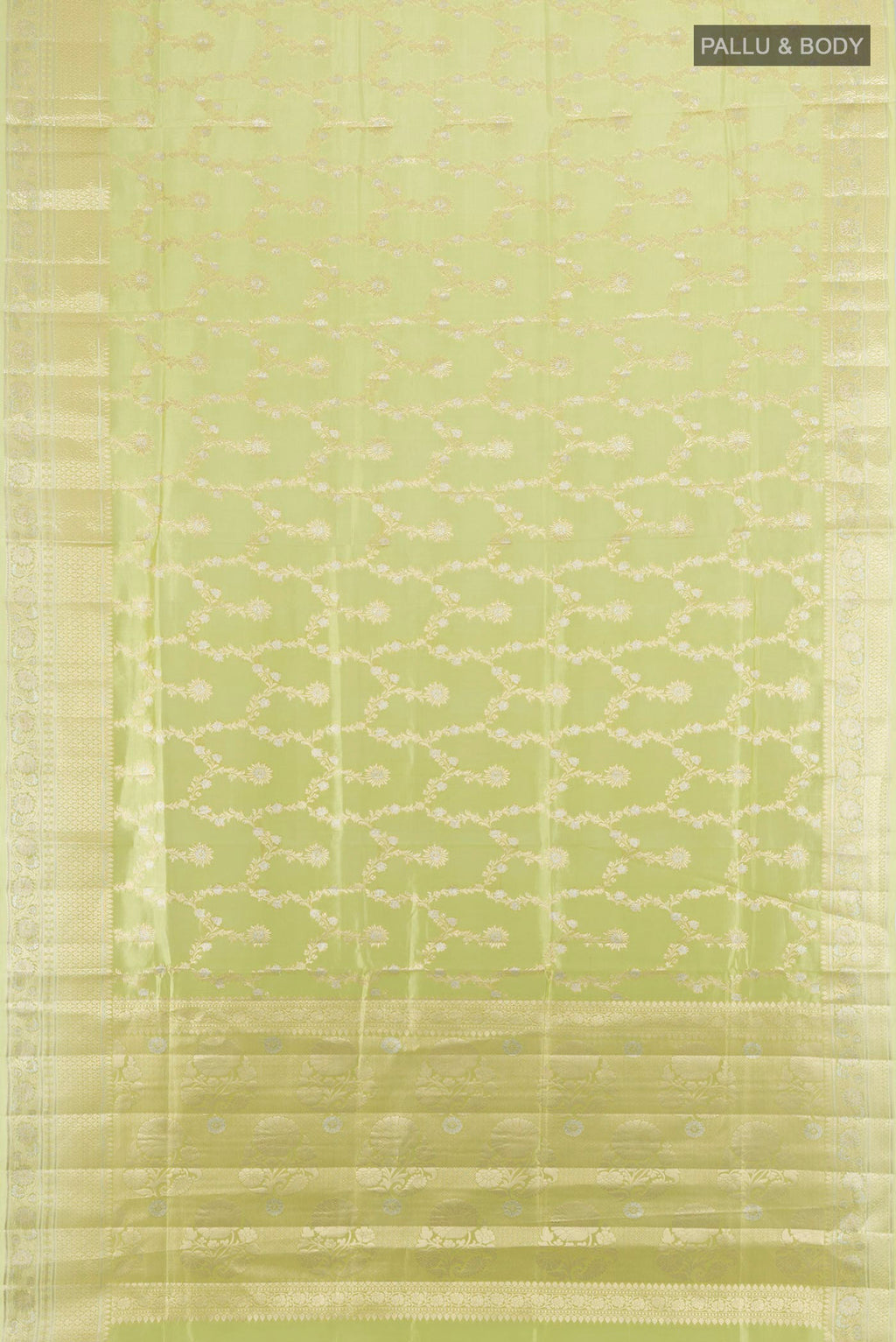 Flat view of Pure Silk Pista Green Banarasi Raw Saree with Zari Butta on the body and Zari Border. 