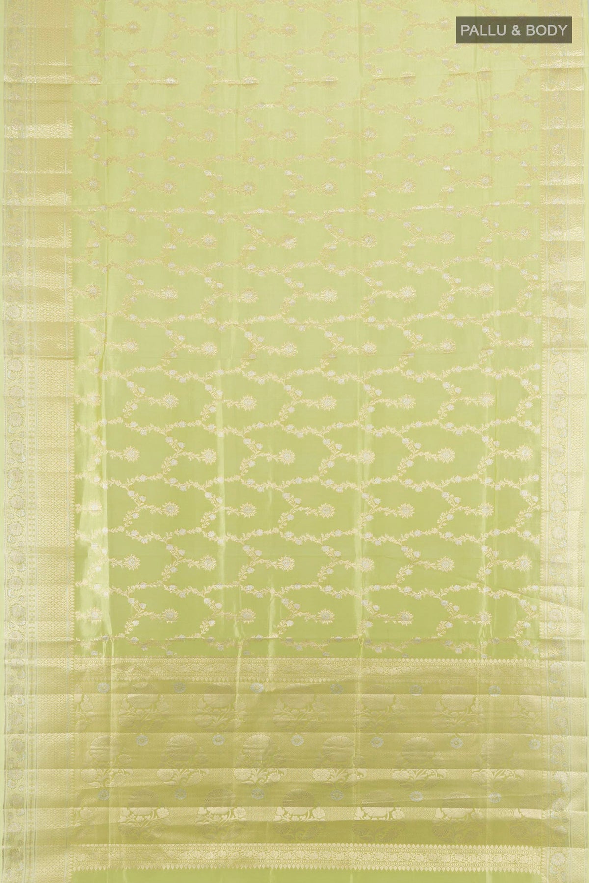 Flat view of Pure Silk Pista Green Banarasi Raw Saree with Zari Butta on the body and Zari Border. 