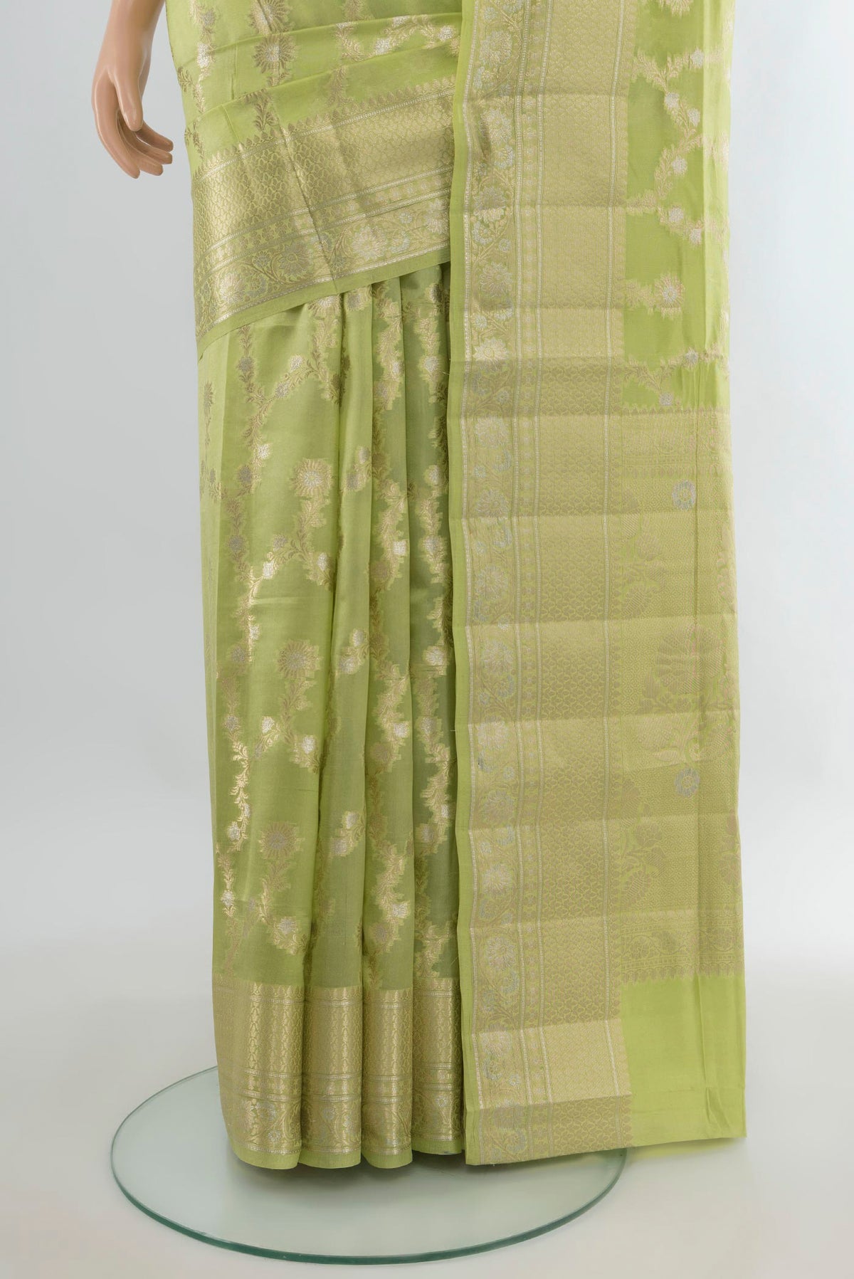 Pleats and pallu of Pure Silk Pista Green Banarasi Raw Saree with Zari Butta on the body and Zari Border. 