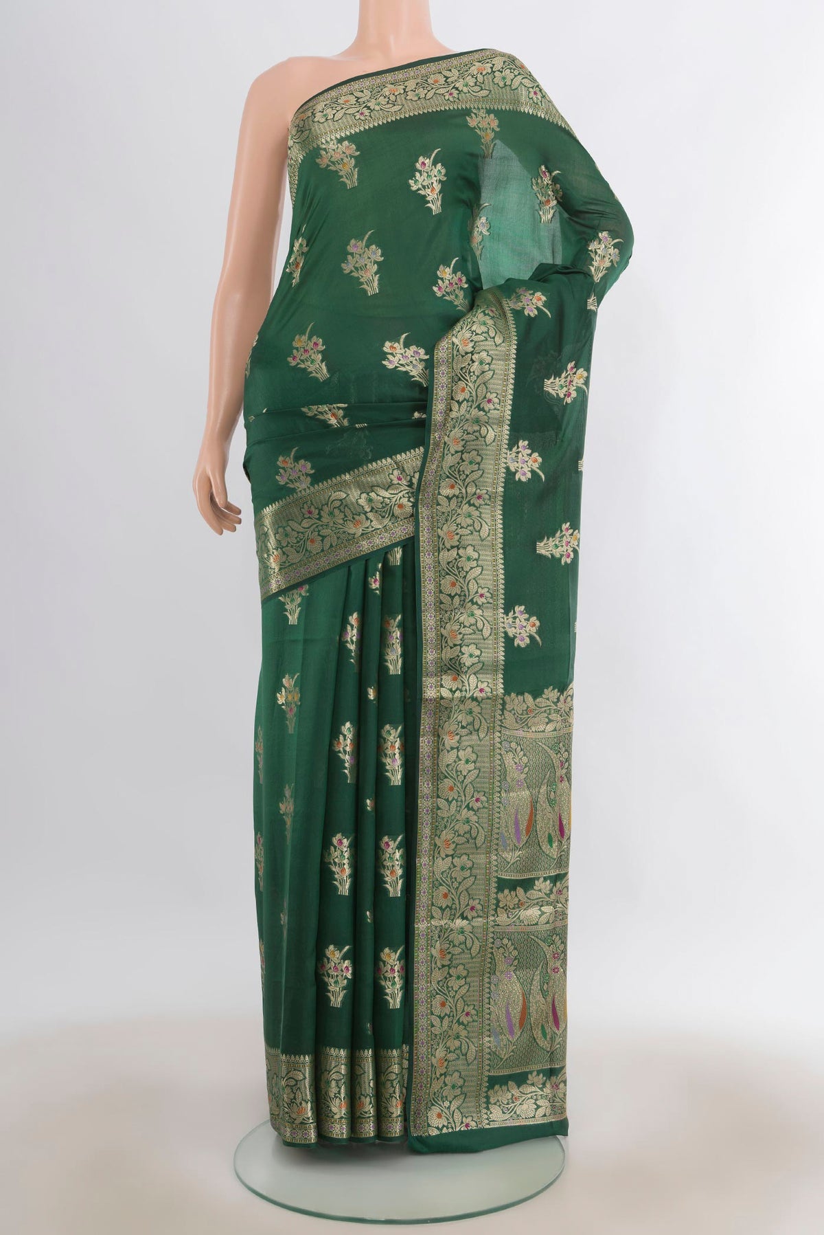 Pure Silk Green Banarasi Tussar Saree with Zari Butta on the body and Zari Border.  displayed on a mannequin