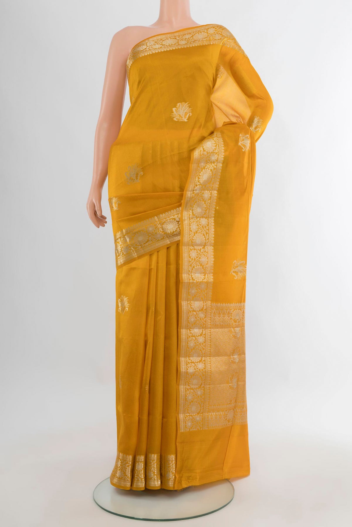 Pure Silk Yellow Banarasi Raw Saree with Zari Butta on the body and Zari Border.  displayed on a mannequin
