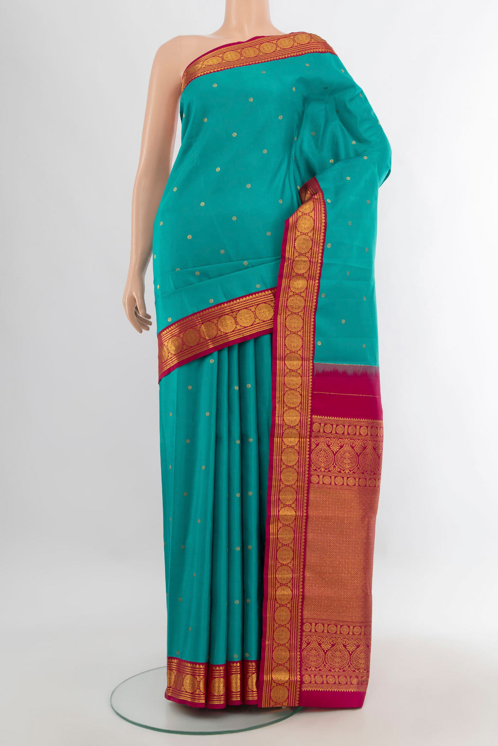 Pure Silk Light Blue Kanjivaram Saree with Zari Butta on the body and Zari Border.  displayed on a mannequin