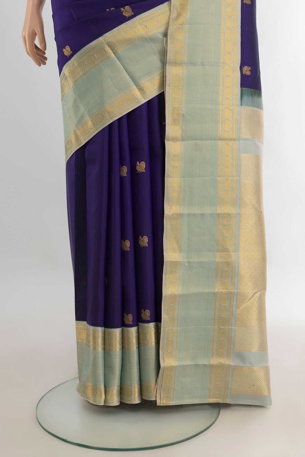 Pleats and pallu of Pure Silk Navy Blue Kanjivaram Saree with Zari Butta on the body and Zari Border. 