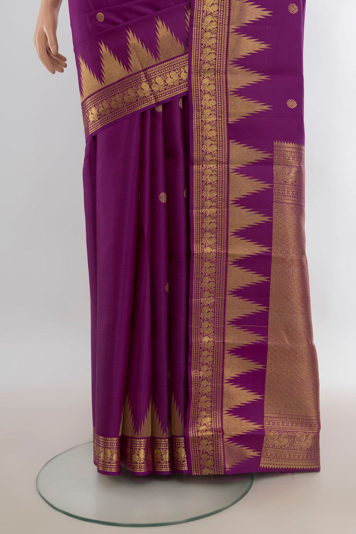 Pleats and pallu of Pure Silk Violet Kanchipuram Saree with Zari Butta on the body and Silk Border. 