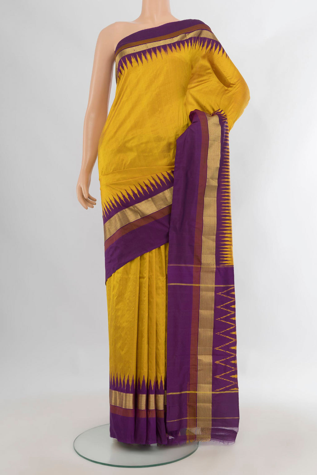 Pure Silk Yellow Pochampally Saree with Plain Body and Zari Border.  displayed on a mannequin