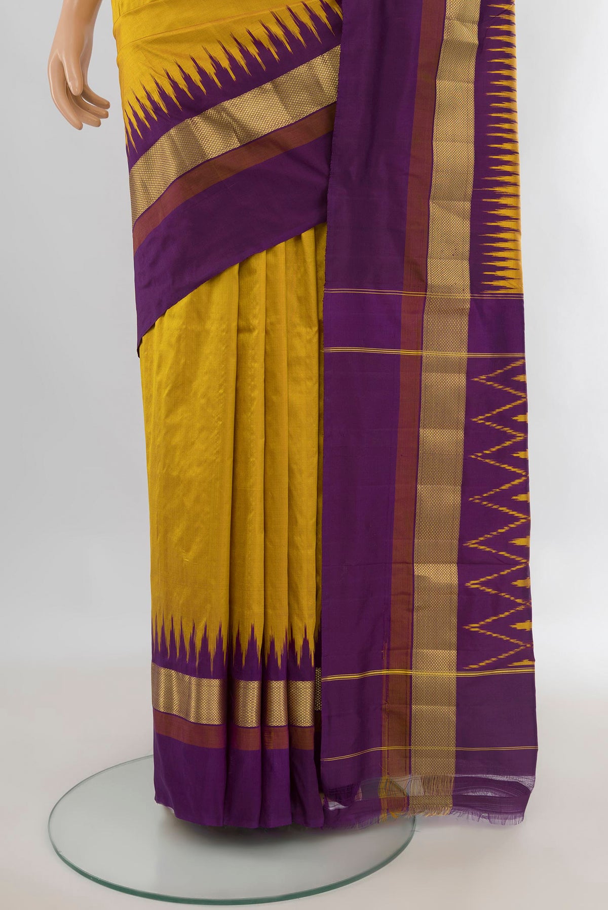 Pleats and pallu of Pure Silk Yellow Pochampally Saree with Plain Body and Zari Border. 