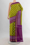 Pure Silk Mehandi Green Pochampally Saree with Pure Ikat on the body and Ikat Border.  displayed on a mannequin