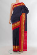 Pure Silk Navy Blue Pochampally Saree with Plain Body and Zari Border.  displayed on a mannequin