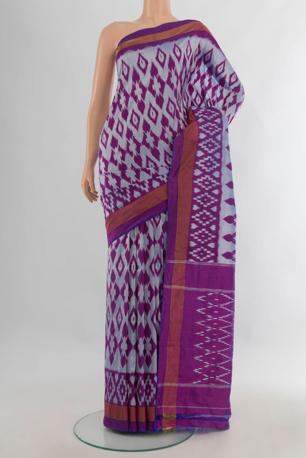 Pure Silk Grey Pochampally Saree with Pure Ikat on the body and Zari Border.  displayed on a mannequin
