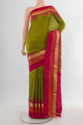 Pure Silk Mehandi Green Pochampally Saree with Plain Body and Zari Border.  displayed on a mannequin