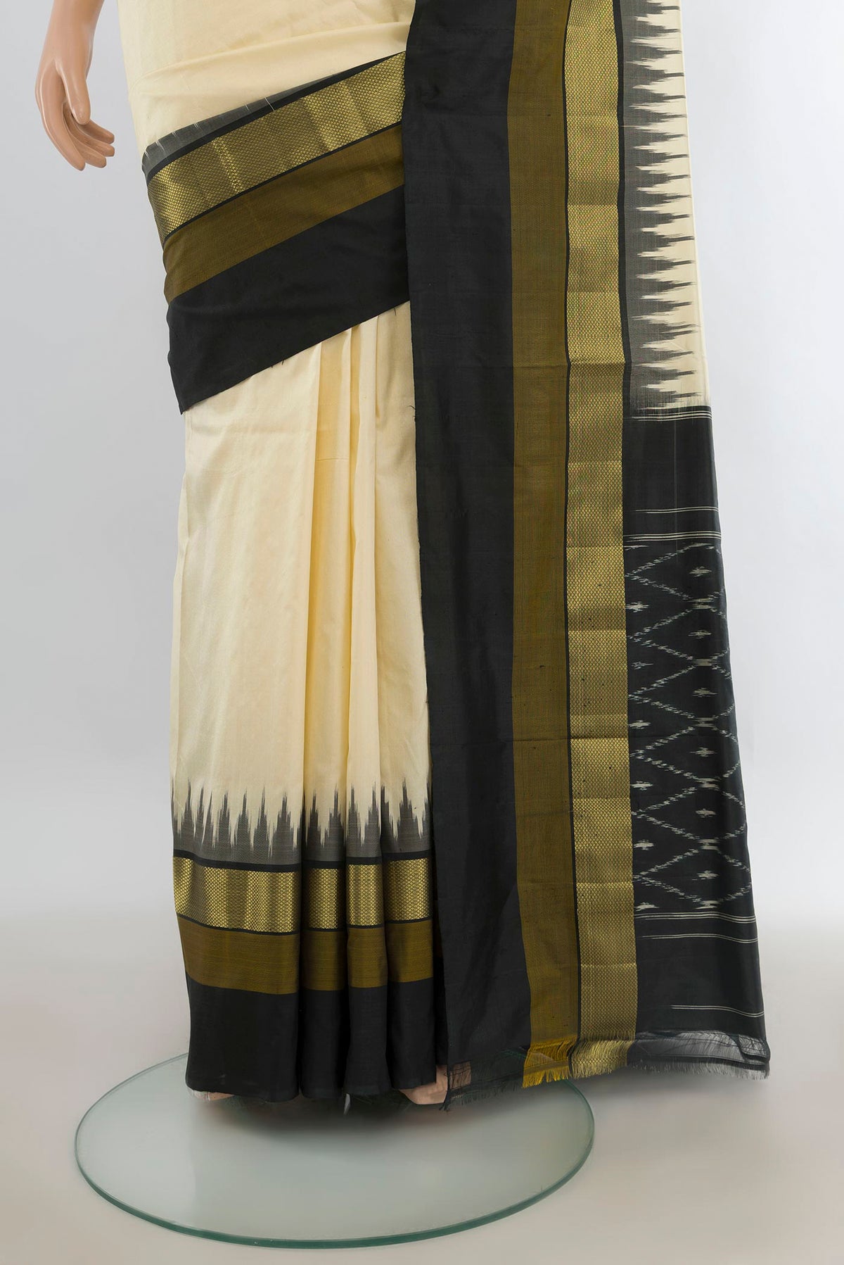 Pleats and pallu of Pure Silk Cream Pochampally Saree with Plain Body and Zari Border. 