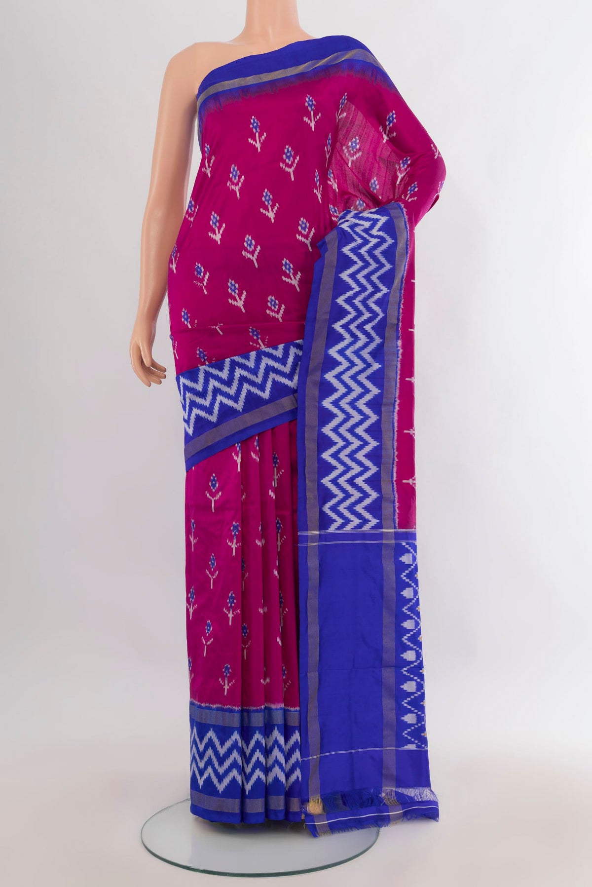 Pure Silk Dark Pink Pochampally Saree with Ikat design on the body and Ikat Border.  displayed on a mannequin