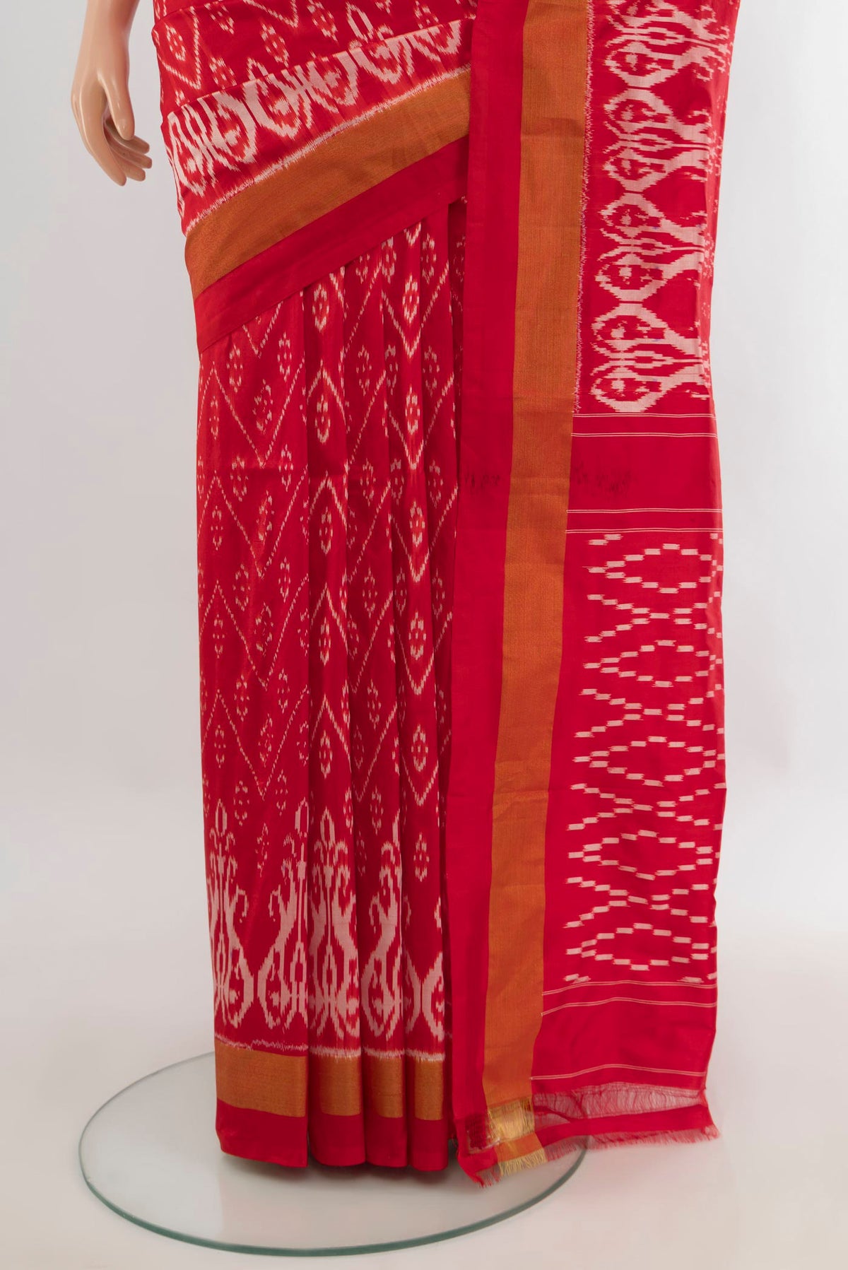 Pleats and pallu of Pure Silk Red Pochampally Saree with Pure Ikat on the body and Zari Border. 