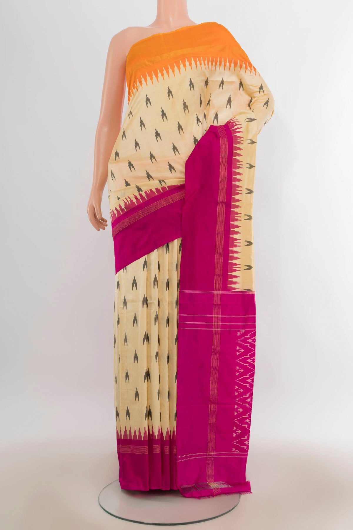 Pure Silk Sandal Pochampally Saree with Pure Ikat on the body and Ganga Jamuna Border.  displayed on a mannequin