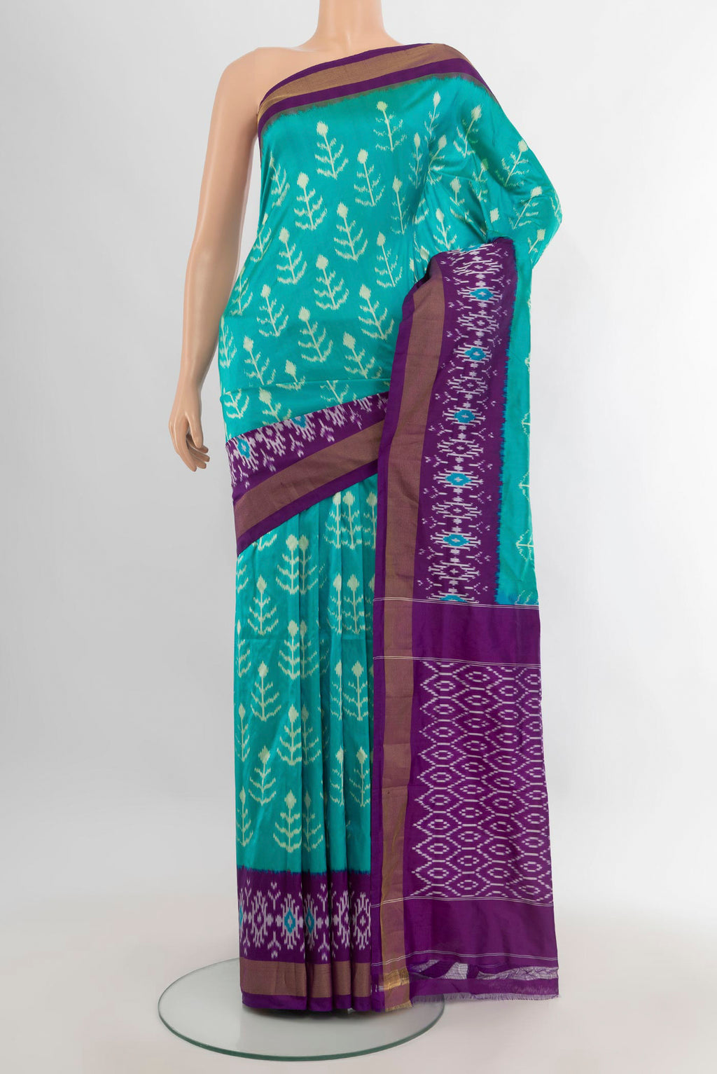 Pure Silk Turquoise Pochampally Saree with Ikat design on the body and Ikat Border.  displayed on a mannequin