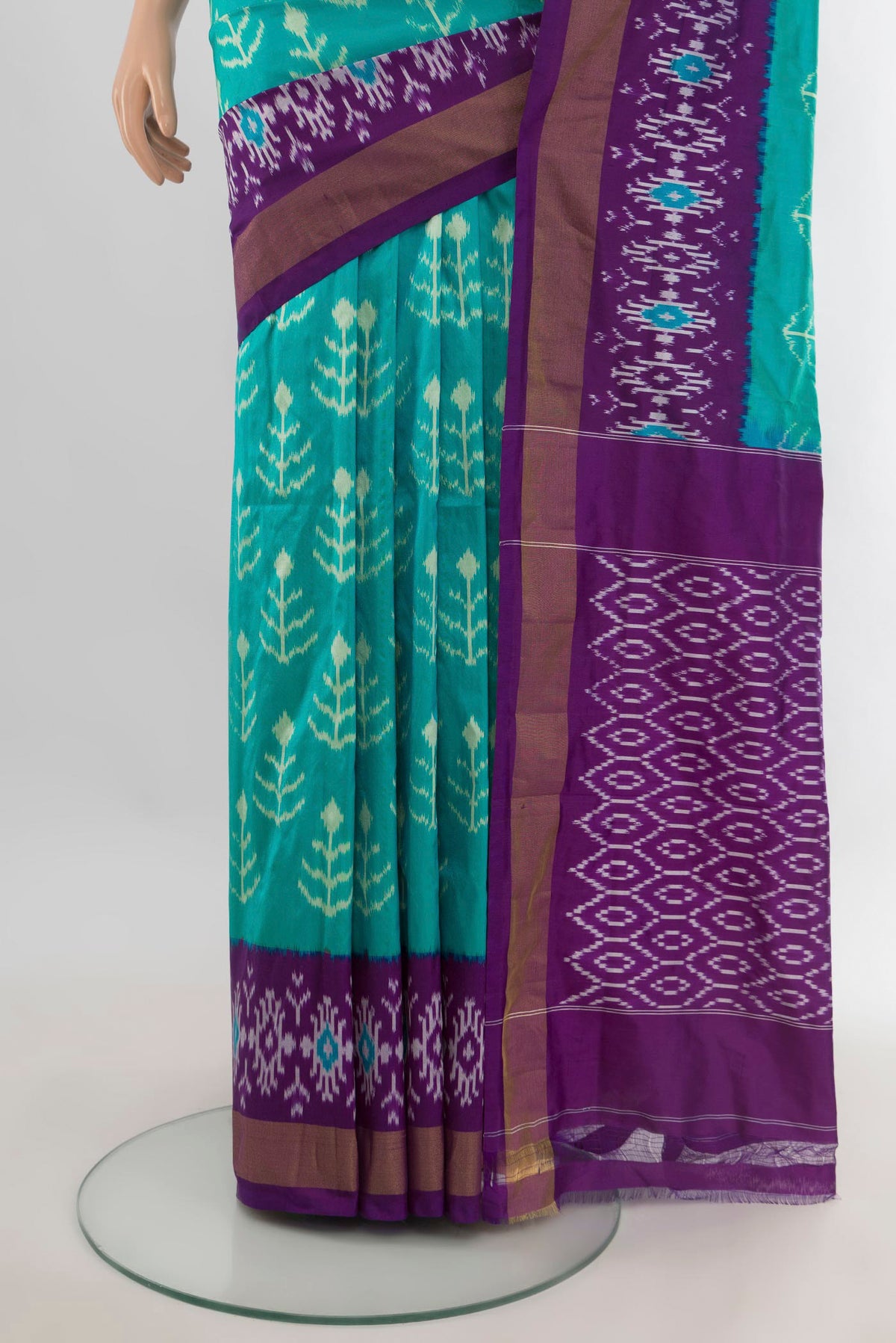 Pleats and pallu of Pure Silk Turquoise Pochampally Saree with Ikat design on the body and Ikat Border. 