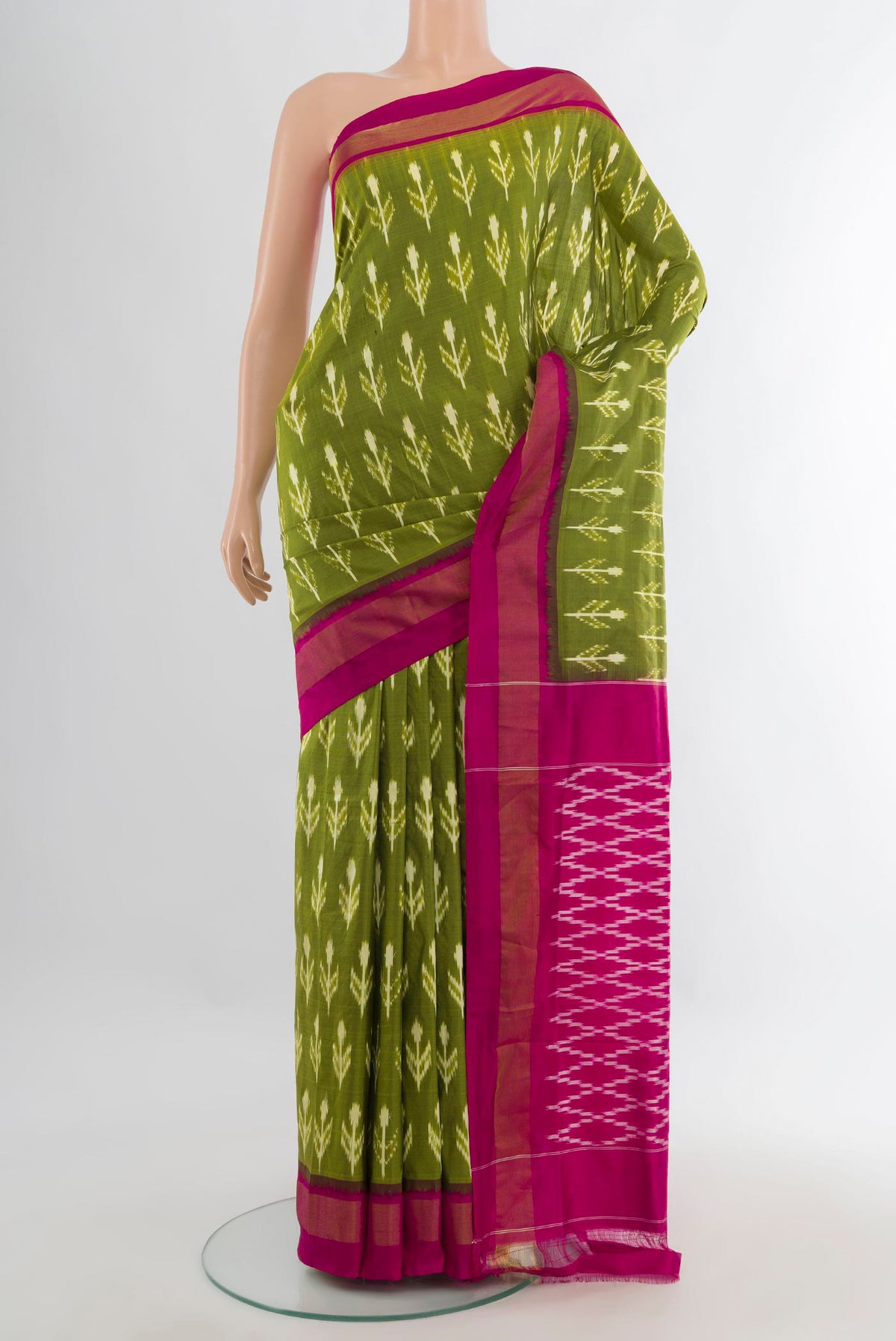 Pure Silk Green Pochampally Saree with Pure Ikat on the body and Zari Border.  displayed on a mannequin