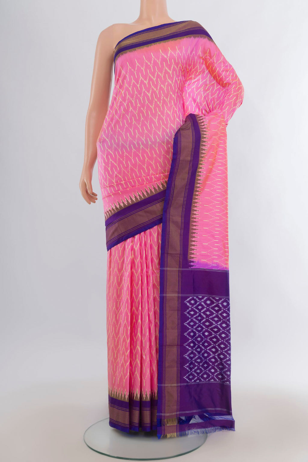 Pure Silk Pink Pochampally Saree with Pure Ikat on the body and Zari Border.  displayed on a mannequin