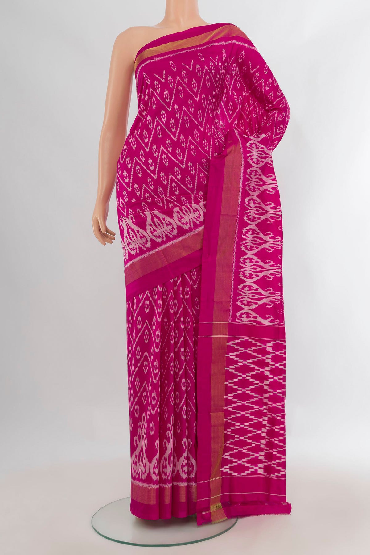 Pure Silk Pink Pochampally Saree with Pure Ikat on the body and Zari Border.  displayed on a mannequin
