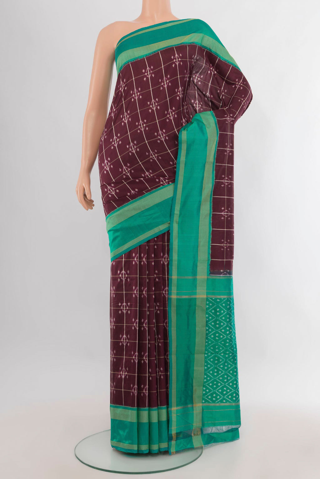 Pure Silk Coffee Brown Pochampally Saree with Ikat design on the body and Ikat Border.  displayed on a mannequin