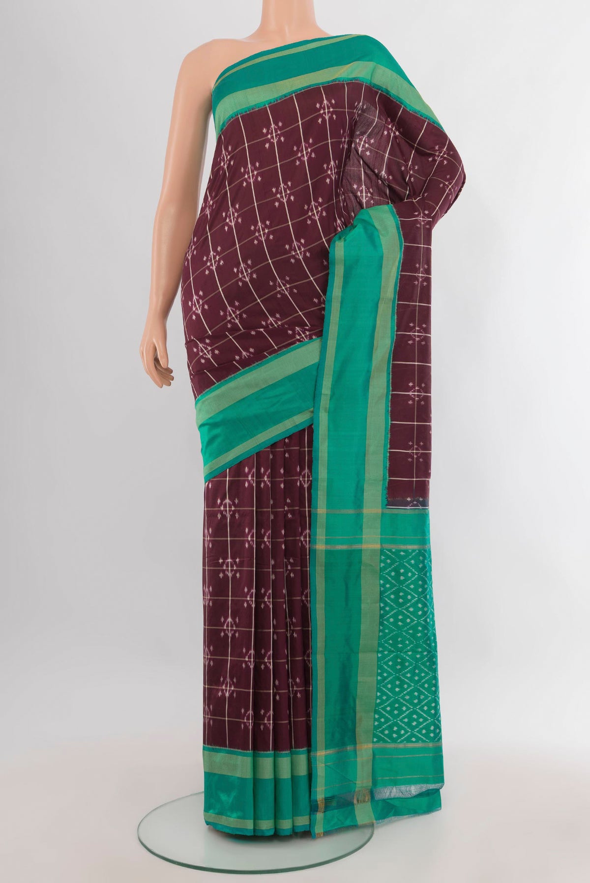 Pure Silk Coffee Brown Pochampally Saree with Ikat design on the body and Ikat Border.  displayed on a mannequin