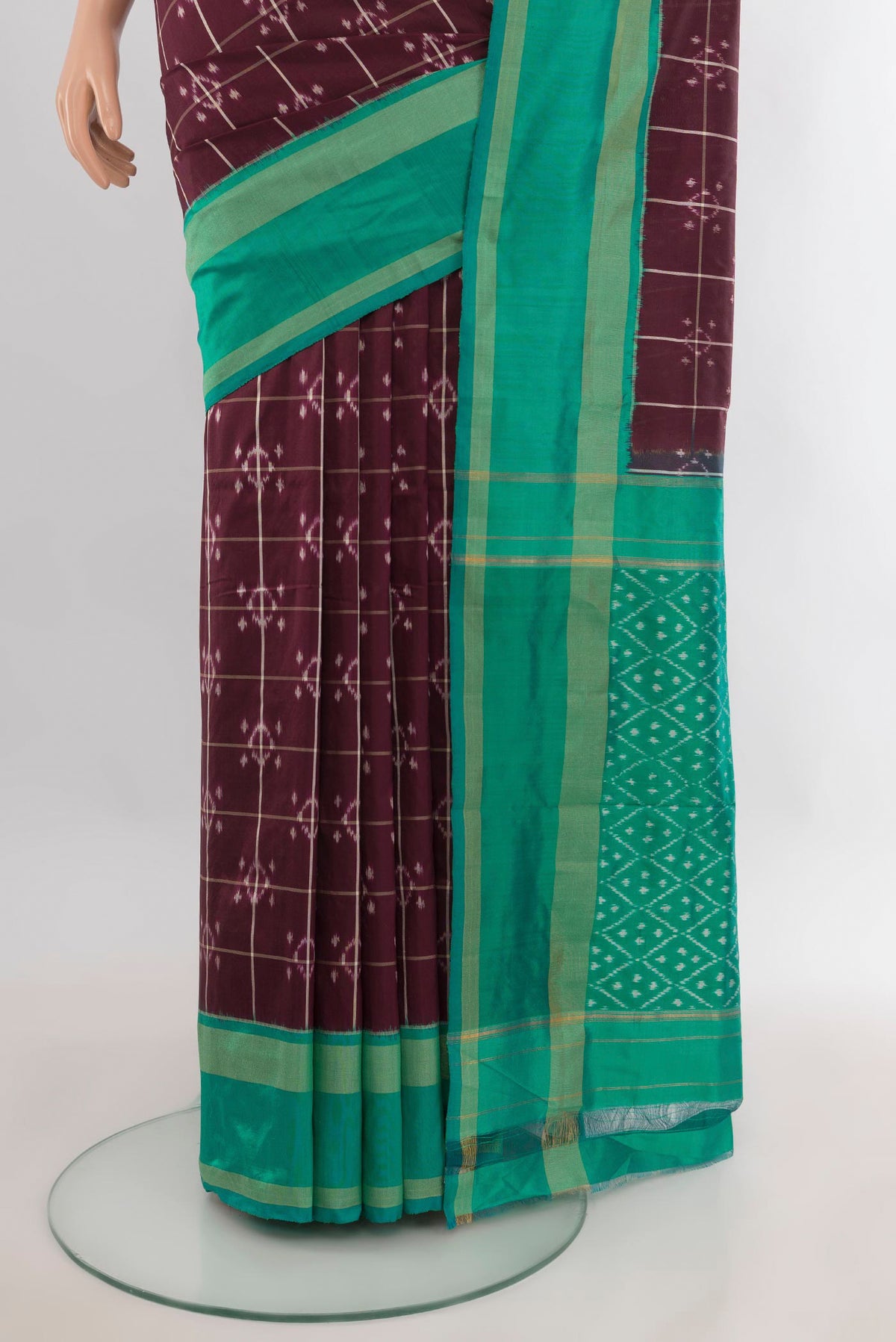 Pleats and pallu of Pure Silk Coffee Brown Pochampally Saree with Ikat design on the body and Ikat Border. 