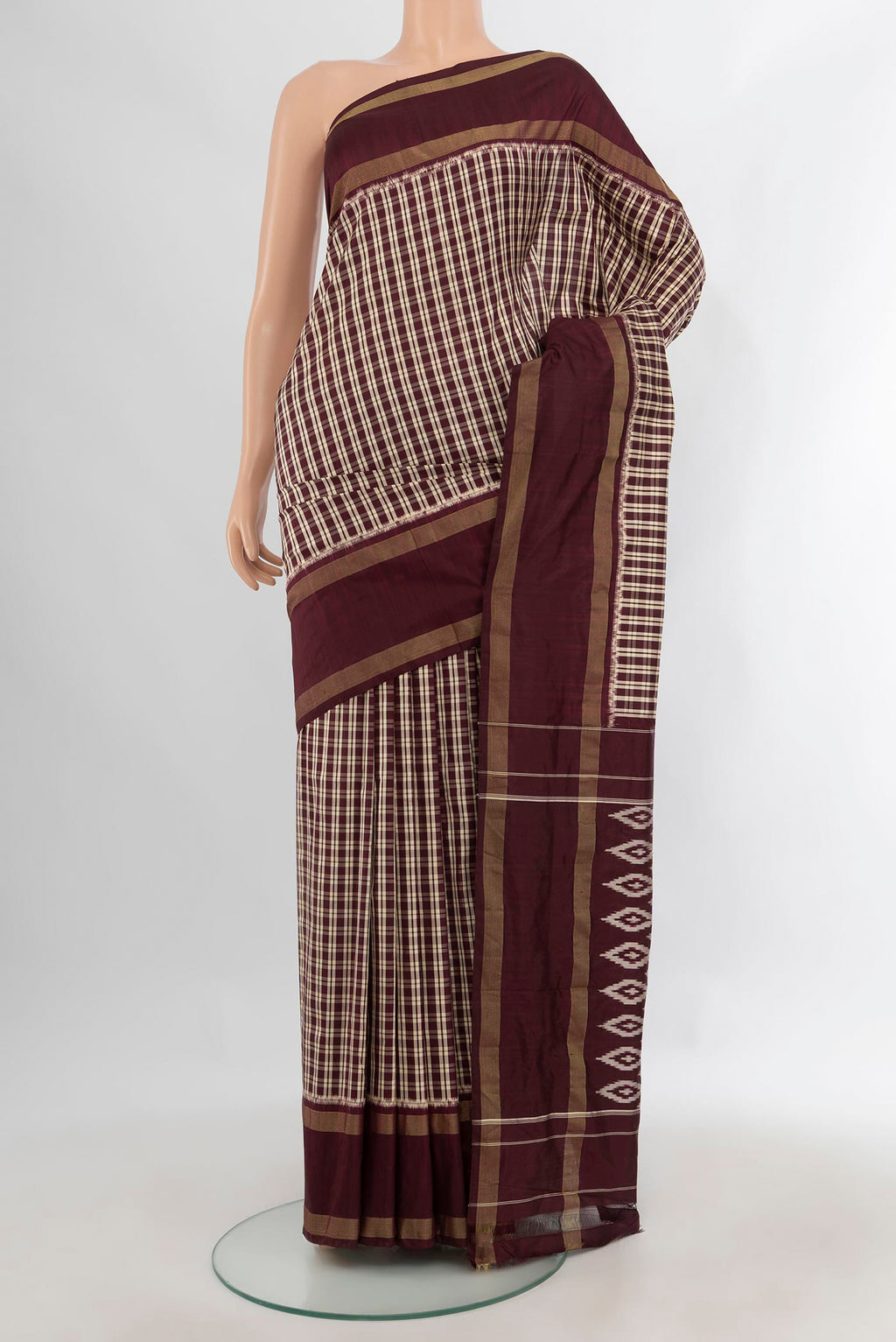 Pure Silk Coffee Brown Pochampally Saree with Checked design on the body and Zari Border.  displayed on a mannequin