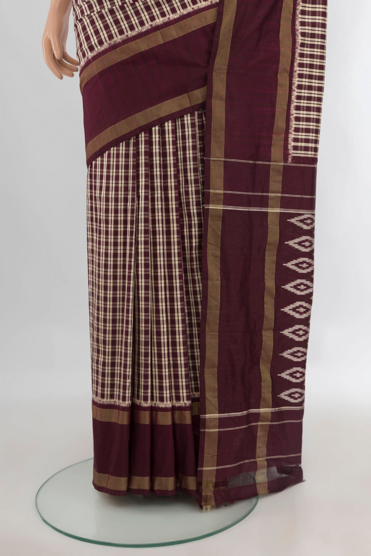 Pleats and pallu of Pure Silk Coffee Brown Pochampally Saree with Checked design on the body and Zari Border. 