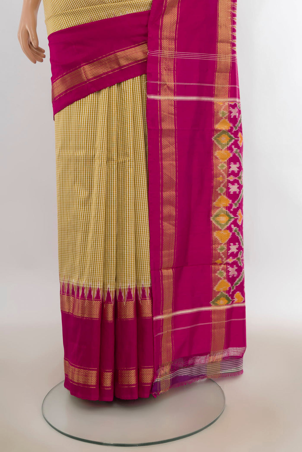 Pleats and pallu of Pure Silk Sandal Pochampally Saree with Checked design on the body and Zari Border. 