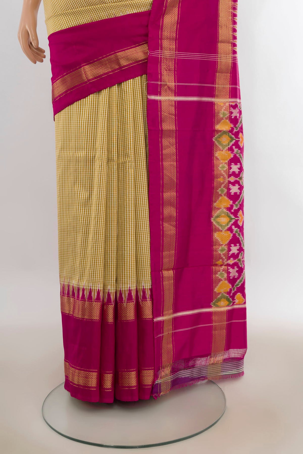 Pleats and pallu of Pure Silk Sandal Pochampally Saree with Checked design on the body and Zari Border. 