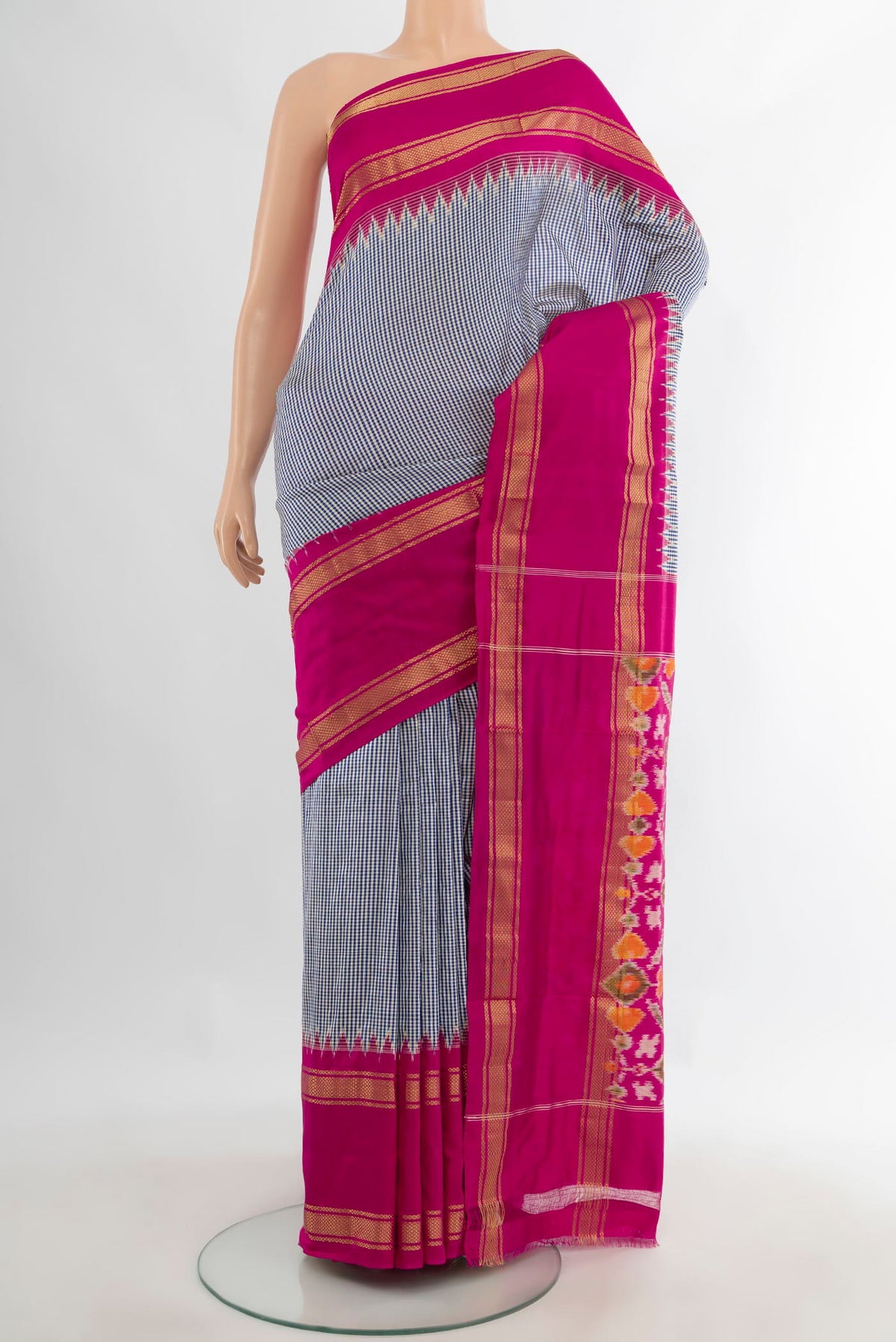 Pure Silk Blue Pochampally Saree with Checked design on the body and Zari Border.  displayed on a mannequin