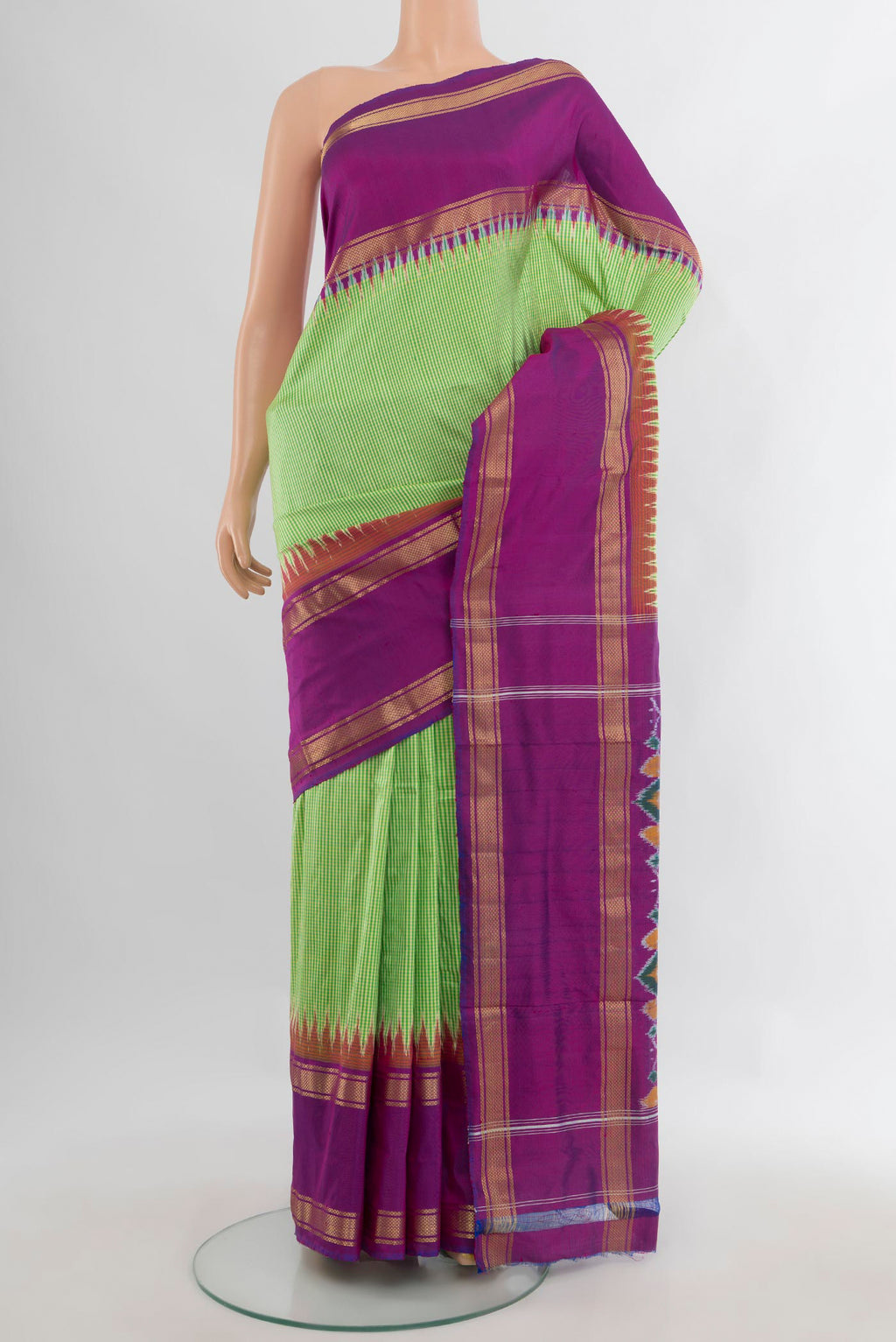Pure Silk Green Pochampally Saree with Checked design on the body and Zari Border.  displayed on a mannequin