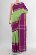 Pure Silk Green Pochampally Saree with Checked design on the body and Zari Border.  displayed on a mannequin